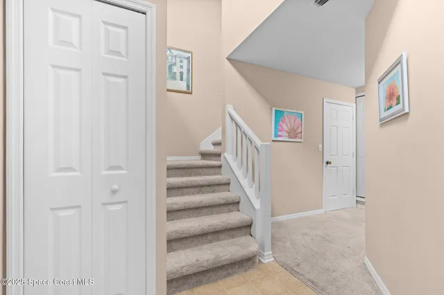 a view of a hallway with staircase