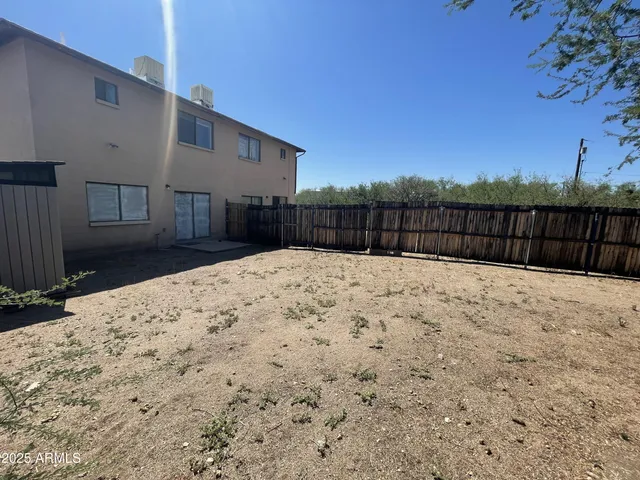 a view of a backyard of the house