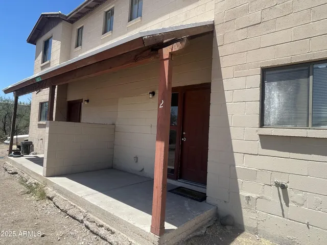 a view of a house with a door and chair