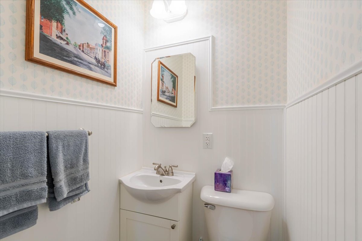 302 Radliff Road Bloomington, IL 61701 - Photo 16 of 35 a bathroom with a toilet sink and mirror