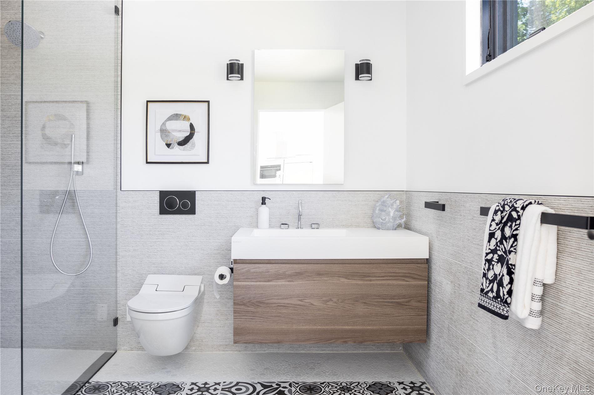 290 Windward Road Orient, NY 11957 - Photo 25 of 31 a bathroom with a sink a toilet and shower