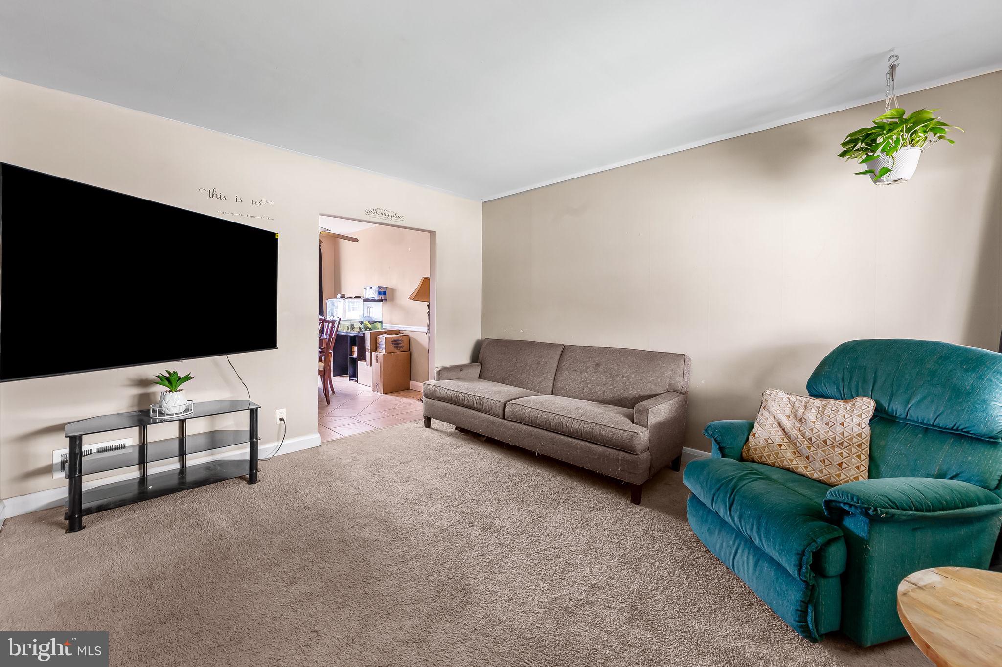 2855 Plainfield Road Baltimore, MD 21222 - Photo 5 of 27 a living room with furniture and a flat screen tv