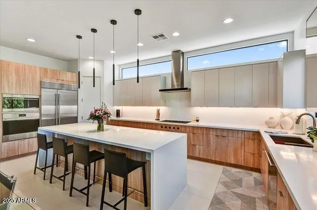 a bedroom with a large bed and a flat screen tv