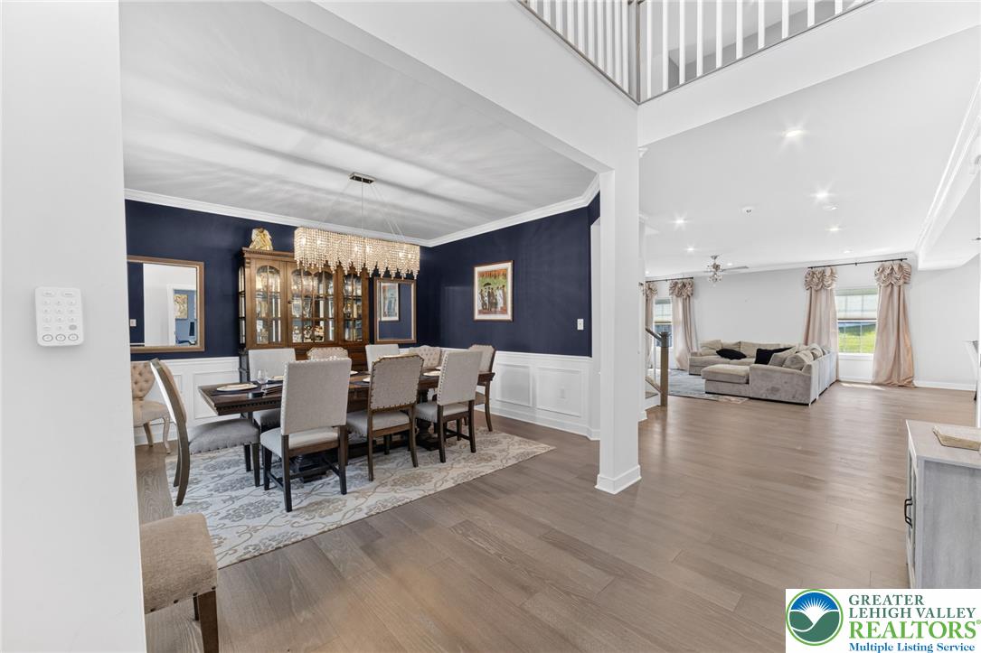 3952 Orth Street Bethlehem, PA 18020 - Photo 6 of 60 Elegant hardwood flooring extends throughout this luminous, open-concept dining area and living space.