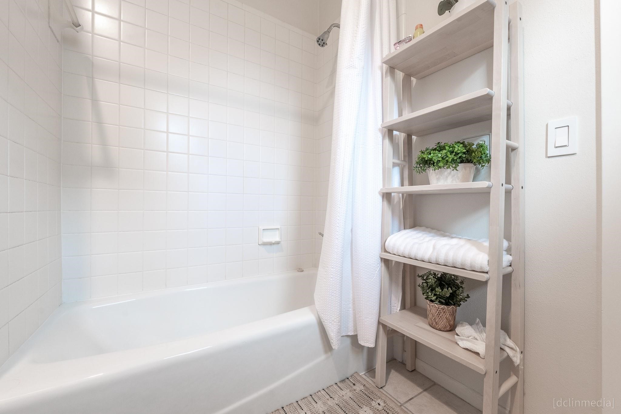 2002 Norfolk Street, Unit A Houston, TX 77098 - Photo 35 of 35 a bathroom with a tub and a window