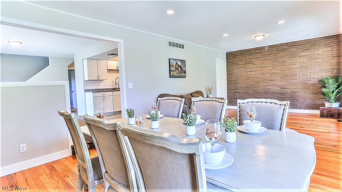 2116 Portage Line Road Mogadore, OH 44260 - Photo 9 of 35 *DINING SET UP ON ONE SIDE OF THE LIVING ROOM NEXT TO THE BEAUTIFUL WINDOWS! ~