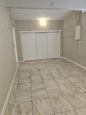 a view of an empty room and window