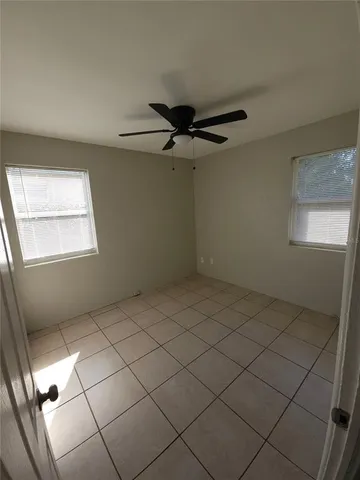 a bathroom with a sink a toilet and a window