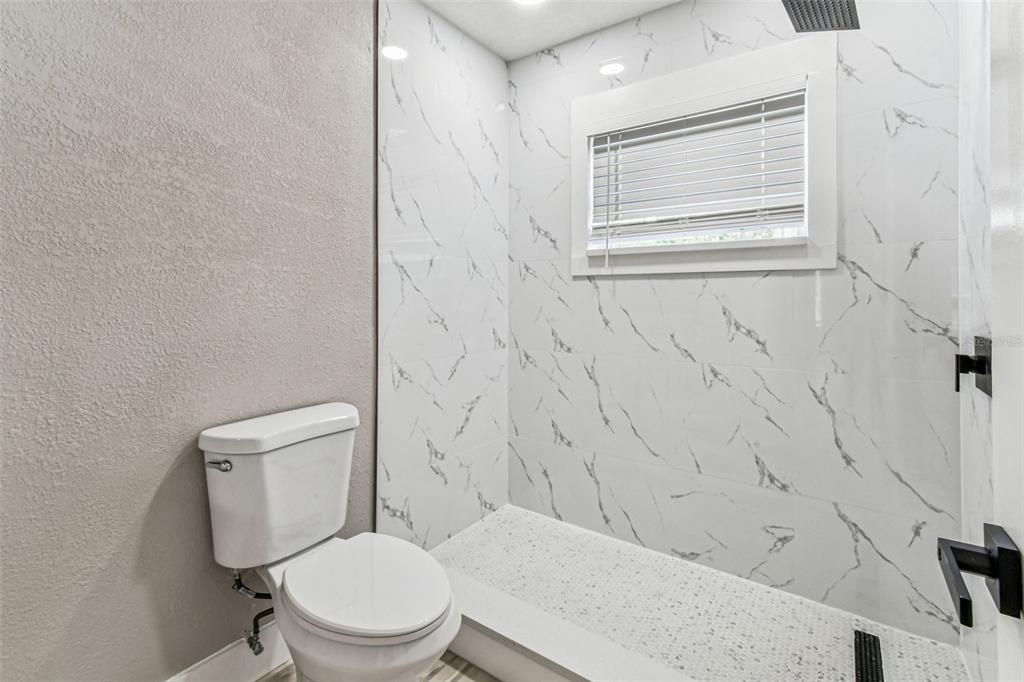 5 West Spanish Main Street Tampa, FL 33609 - Photo 20 of 72 a white toilet sitting next to a bathroom sink