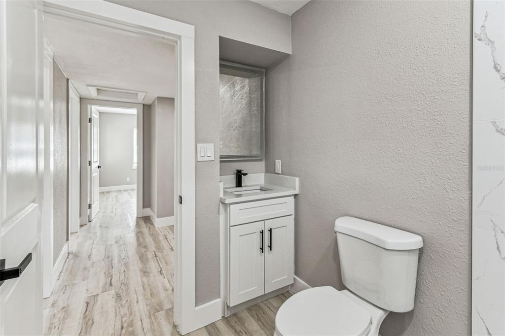 5 West Spanish Main Street Tampa, FL 33609 - Photo 21 of 72 a bathroom with a toilet sink and a mirror