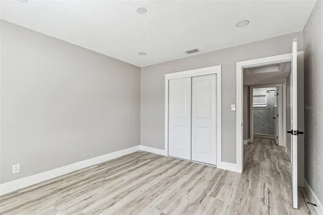 a view of a field with an trees