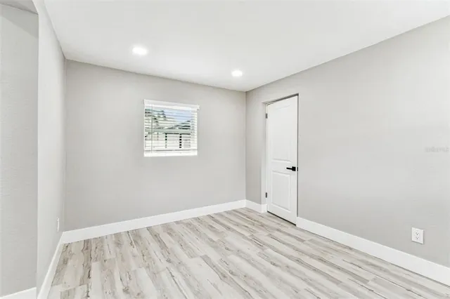 a front view of a house with a garden and yard