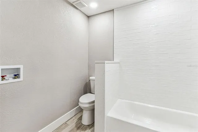 an aerial view of a city with lots of residential buildings lake and ocean view