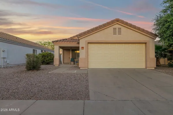 a front view of house with garage and yard