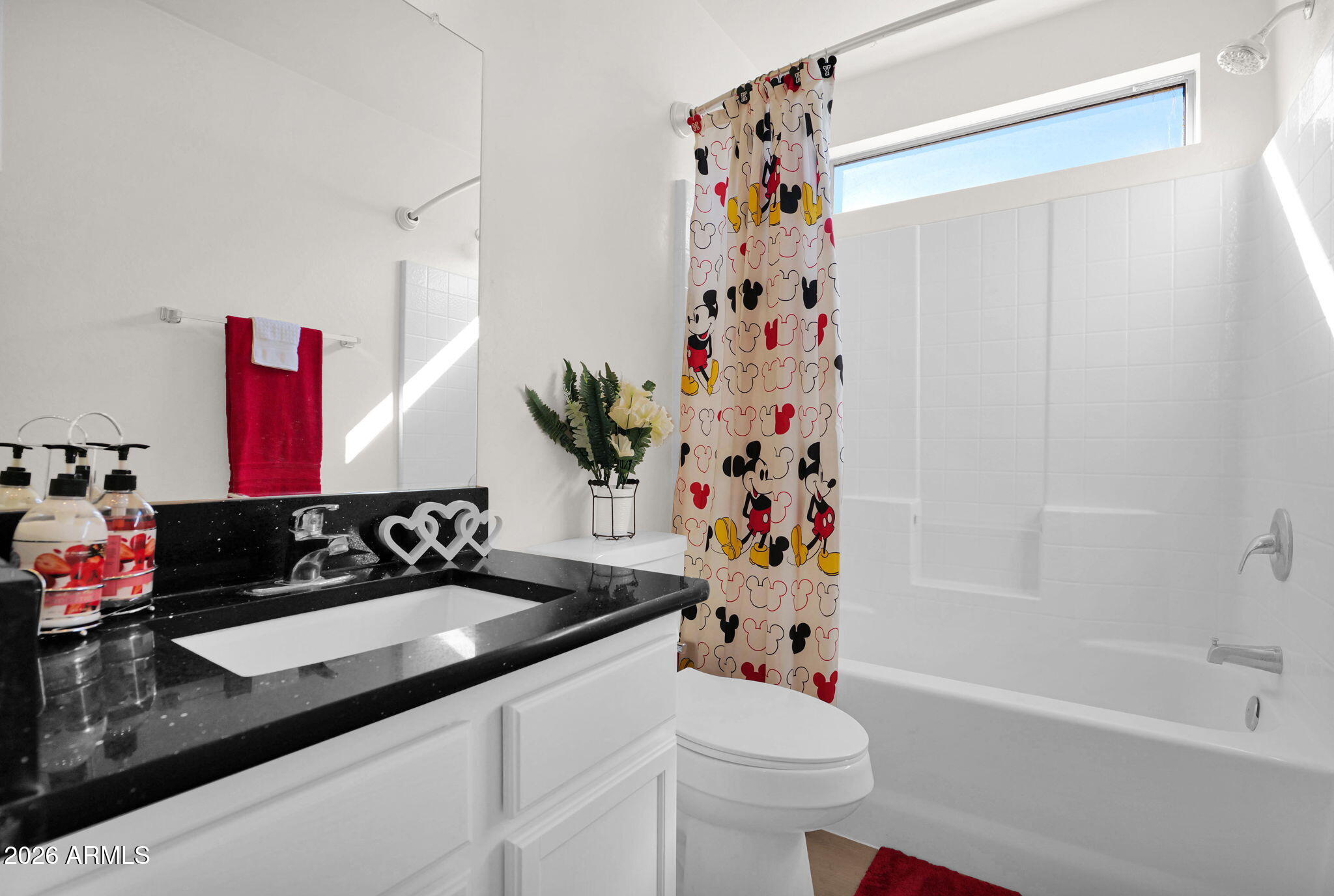 429 South Labelle Mesa, AZ 85208 - Photo 23 of 35 a bathroom with a sink a toilet and a shower curtain