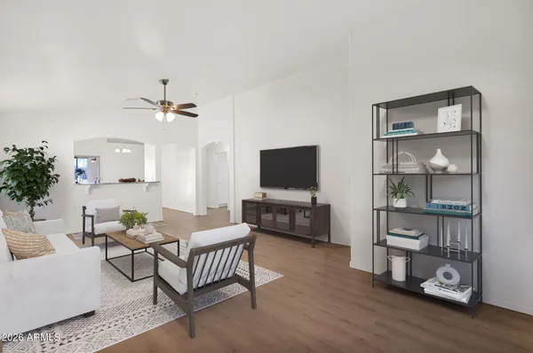 a living room with furniture and a flat screen tv