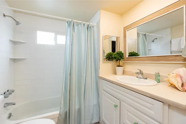 a view of a hallway with washer and dryer