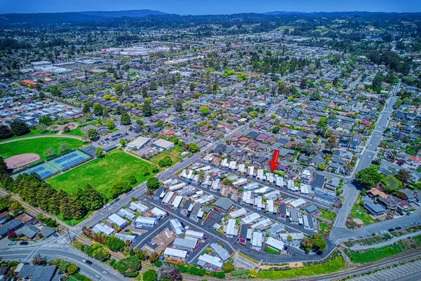 a view of kitchen with cabinets and wooden floor