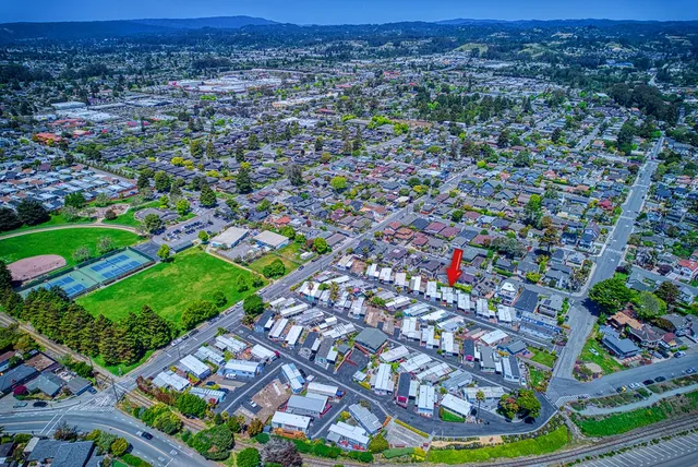a view of kitchen with cabinets and wooden floor