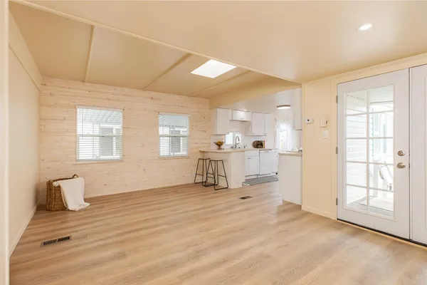 a kitchen with a stove a sink dishwasher and a refrigerator