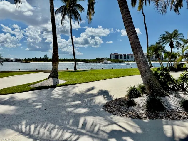 a view of a swimming pool and a longer chairs