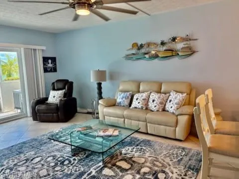 a living room with furniture fireplace and window