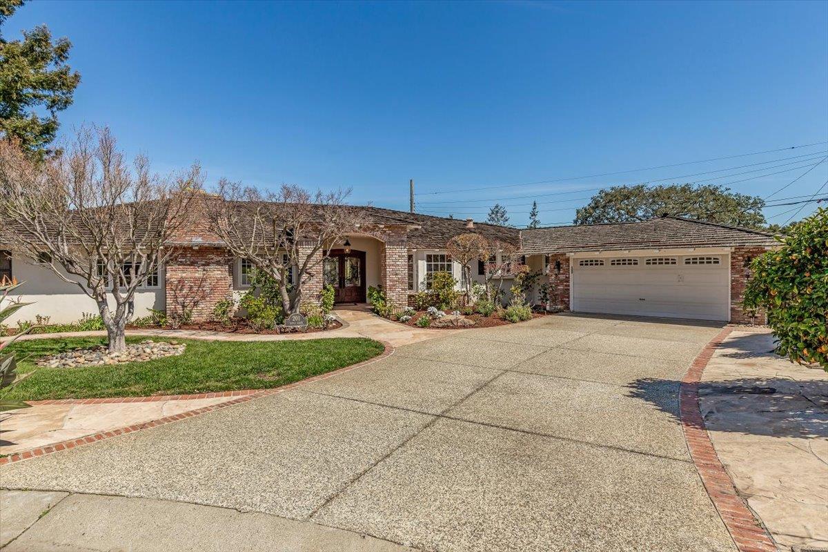 Silvia Court Los Altos, CA 94024 - Photo 1 of 44 a front view of a house with a yard and garage