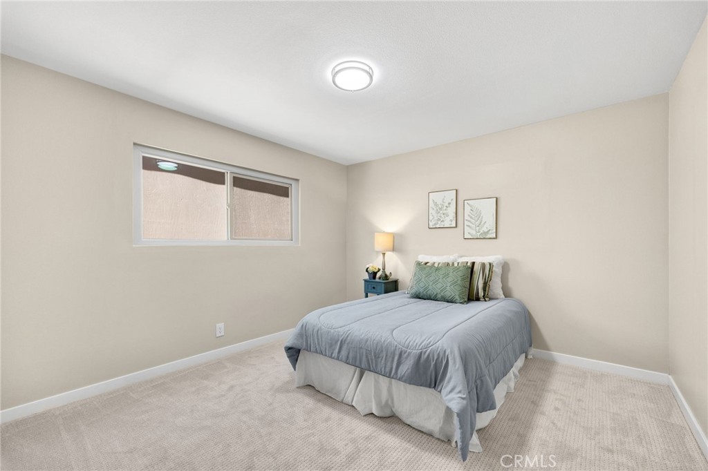 909 Orangewood Drive Brea, CA 92821 - Photo 12 of 19 a bedroom with a bed and a night stand