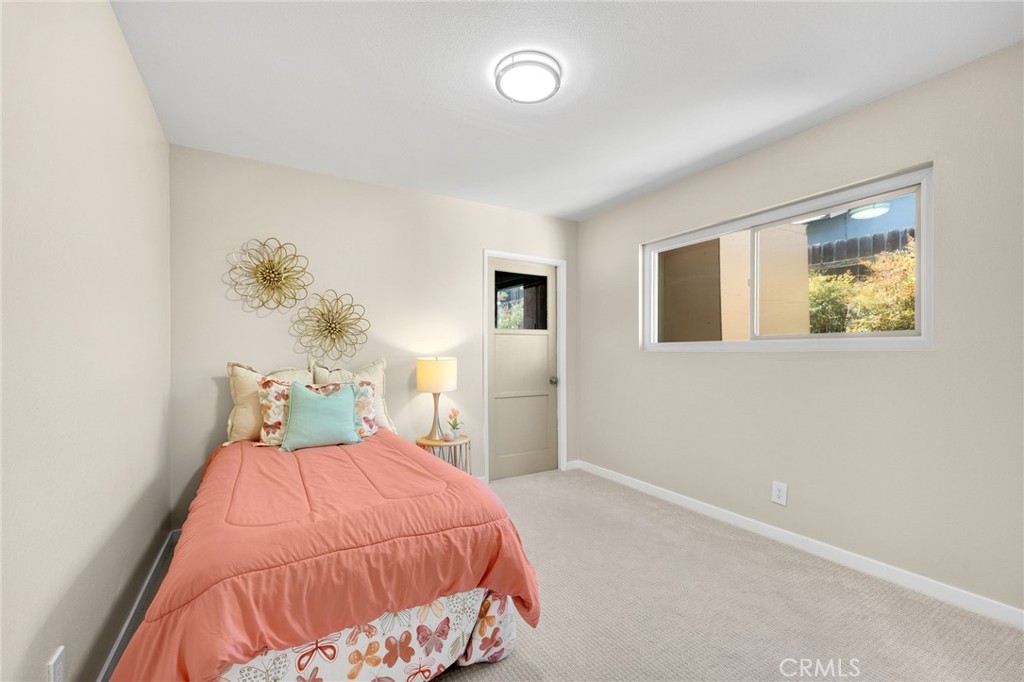 909 Orangewood Drive Brea, CA 92821 - Photo 14 of 19 a bedroom with a bed and a painting on the wall