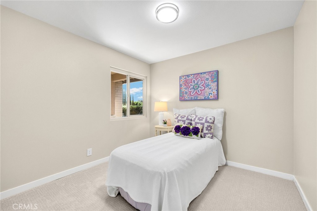 909 Orangewood Drive Brea, CA 92821 - Photo 15 of 19 a bedroom with a bed and a lamp