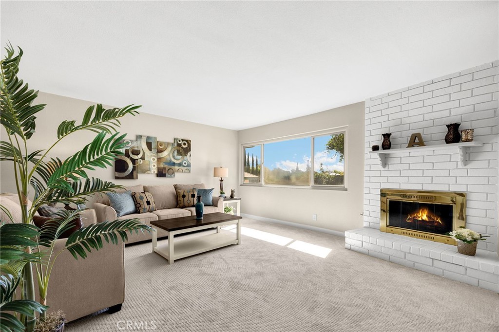 909 Orangewood Drive Brea, CA 92821 - Photo 4 of 19 a living room with furniture and a fireplace