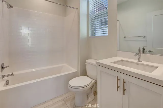 a bathroom with a sink toilet and bathtub