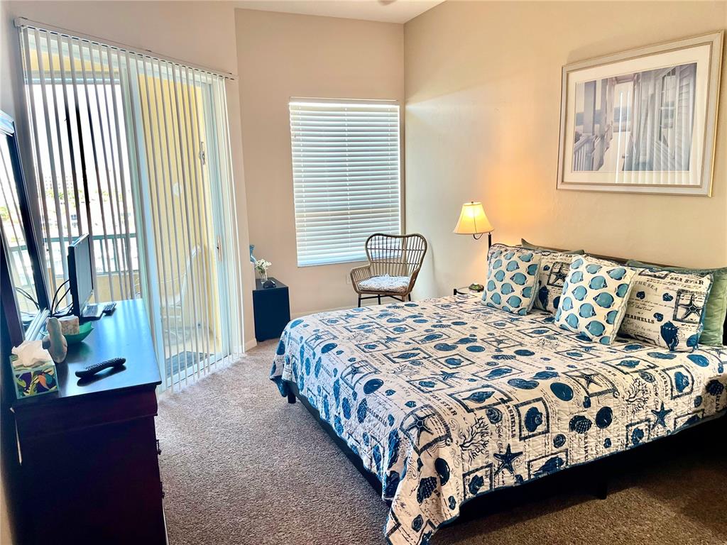 2090 Matecumbe Key Road, Unit 1705 Punta Gorda, FL 33955 - Photo 14 of 31 a bedroom with a bed and window