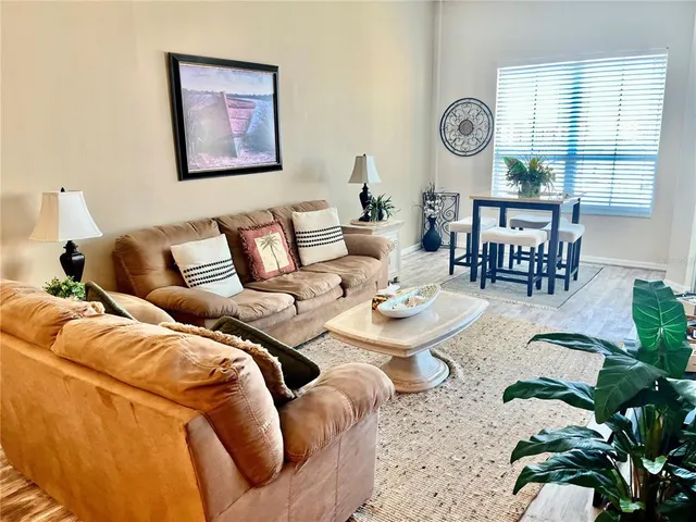 a living room with furniture and a large window