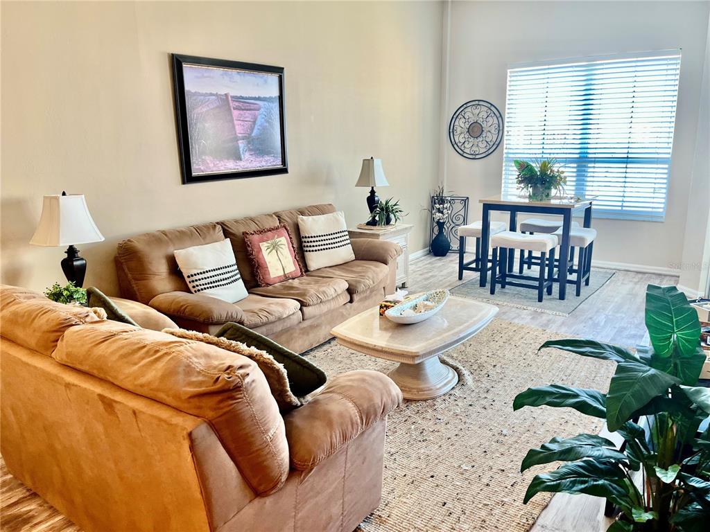 2090 Matecumbe Key Road, Unit 1705 Punta Gorda, FL 33955 - Photo 10 of 31 a living room with furniture and a large window