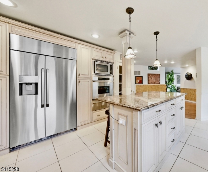 447 Rockaway Valley Road Boonton, NJ 07005 - Photo 11 of 29 a kitchen with kitchen island a counter top space appliances and cabinets