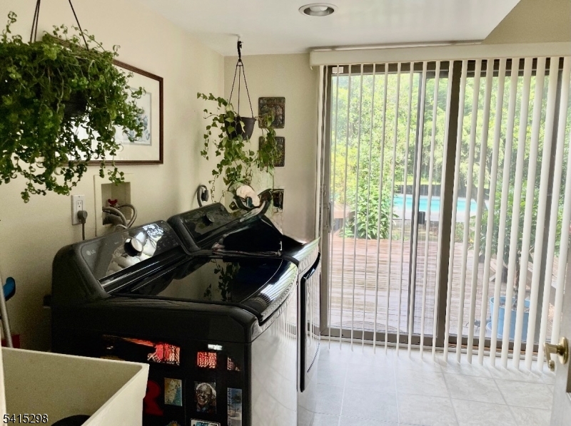 447 Rockaway Valley Road Boonton, NJ 07005 - Photo 13 of 29 a kitchen with a table and a stove