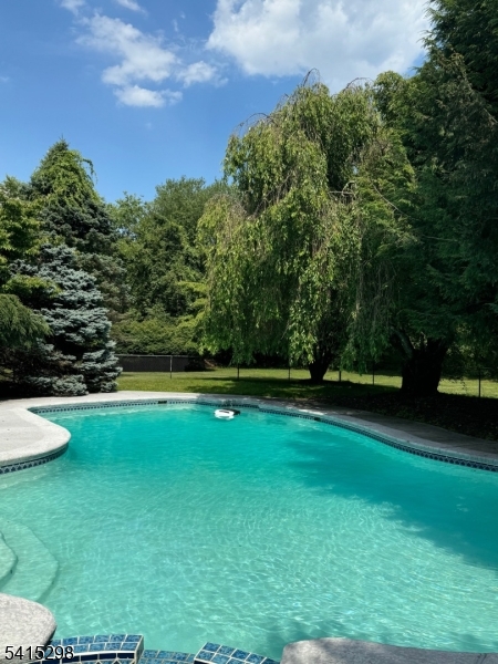 447 Rockaway Valley Road Boonton, NJ 07005 - Photo 18 of 29 a view of a swimming pool with a yard