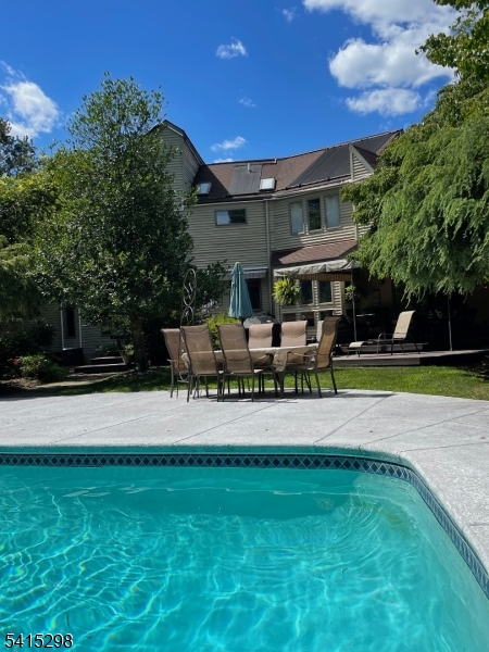 447 Rockaway Valley Road Boonton, NJ 07005 - Photo 19 of 29 a swimming pool with outdoor seating and yard