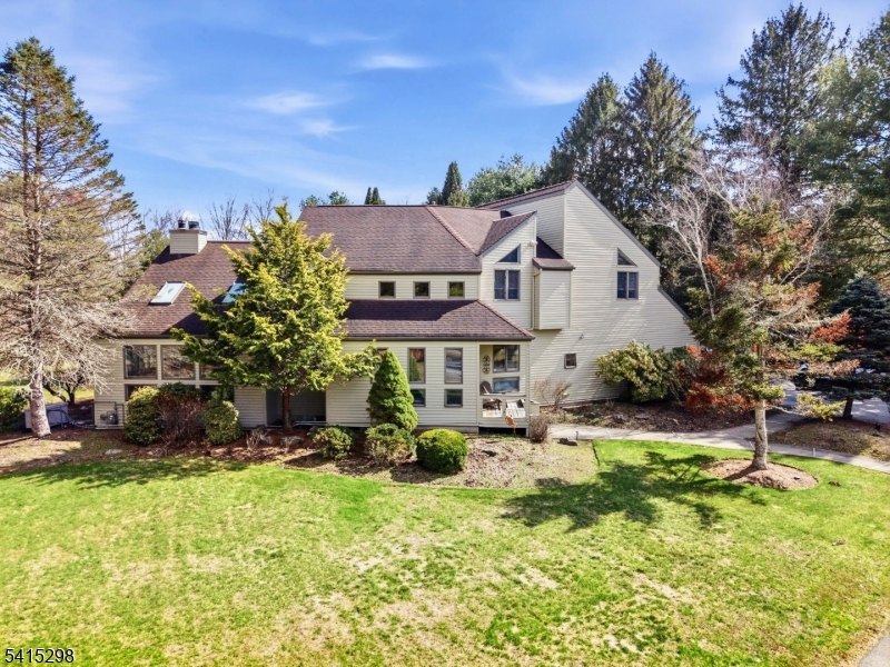 447 Rockaway Valley Road Boonton, NJ 07005 - Photo 4 of 29 a view of a house with a big yard and large trees