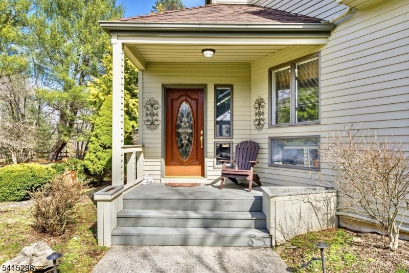 447 Rockaway Valley Road Boonton, NJ 07005 - Photo 5 of 29 a front view of a house with a outdoor seating