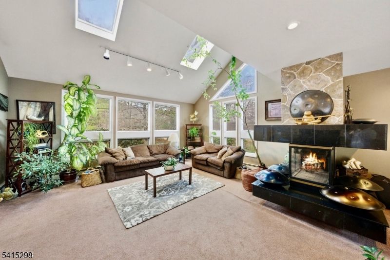 447 Rockaway Valley Road Boonton, NJ 07005 - Photo 7 of 29 a living room with furniture and a fireplace