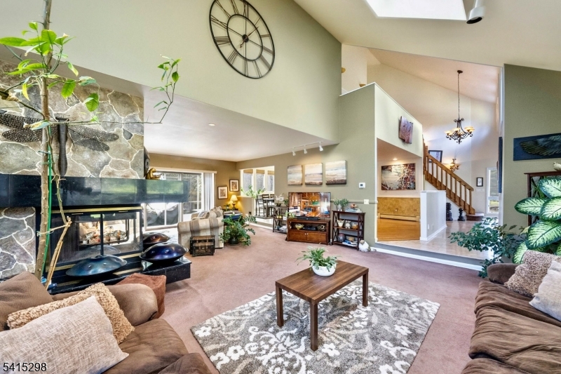 447 Rockaway Valley Road Boonton, NJ 07005 - Photo 9 of 29 a living room with furniture and a floor to ceiling window