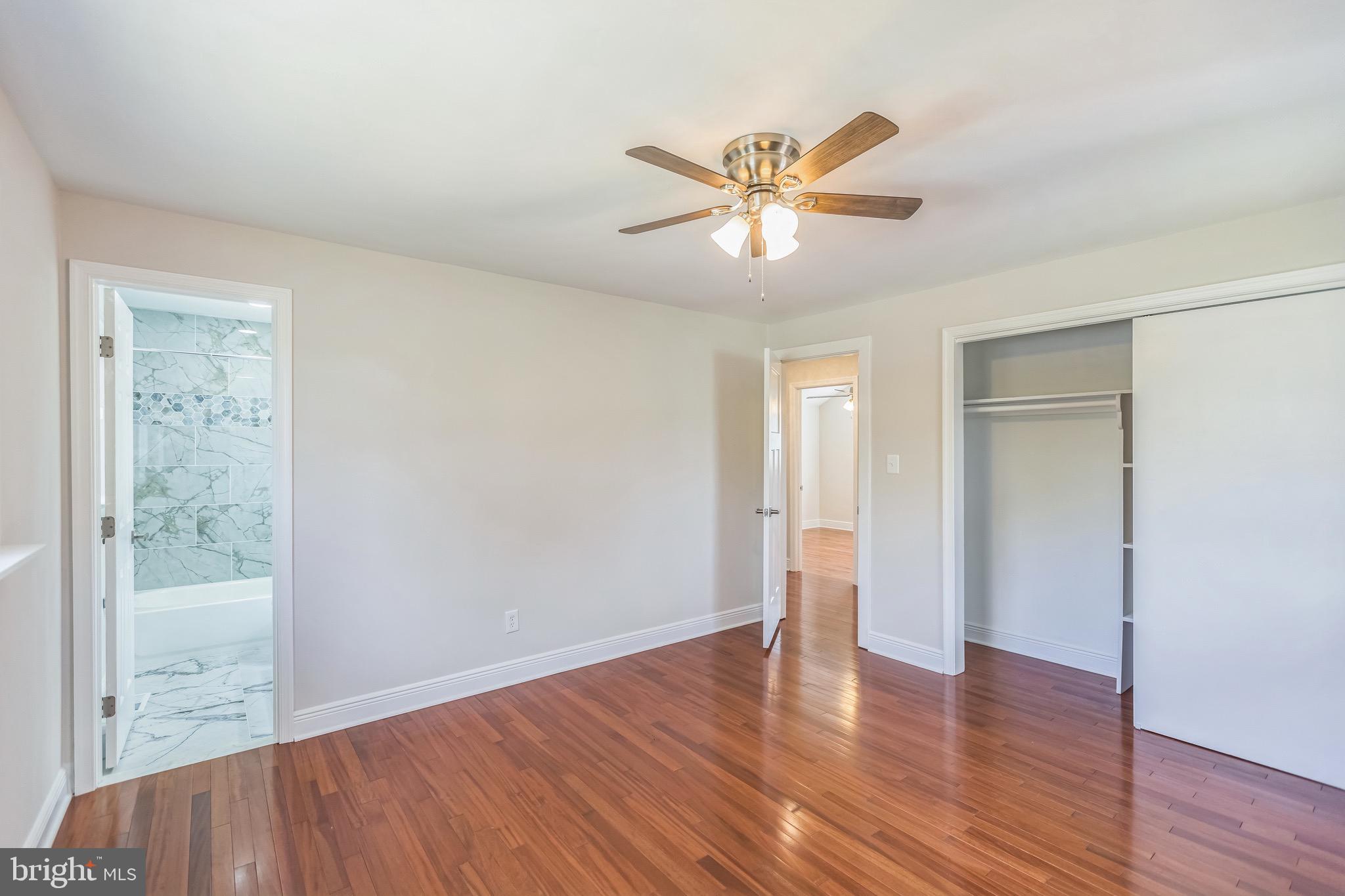 11308 Veirs Mill Road Silver Spring, MD 20902 - Photo 19 of 21 a view of an empty room with wooden floor and a window