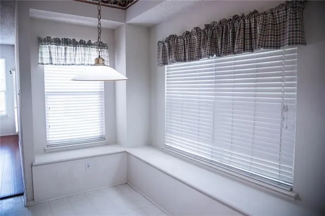 a view of a balcony a window and wooden floor