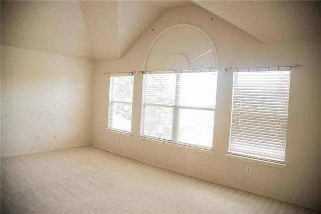 a view of staircase with white walls