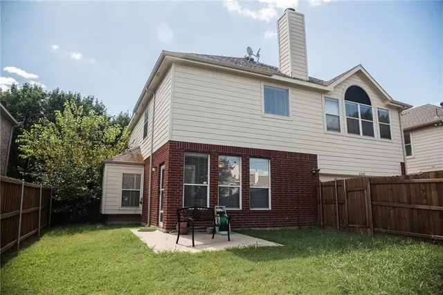 a bathroom with a sink a toilet and shower curtain