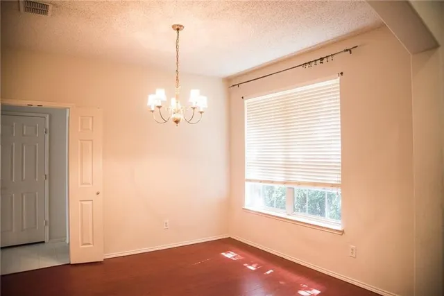 a kitchen with a sink a counter top space and cabinets