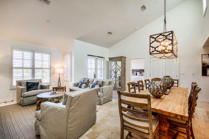 34 North Barrett Square, Unit 3B Inlet Beach, FL 32461 - Photo 1 of 1 a living room with furniture fireplace and a large window