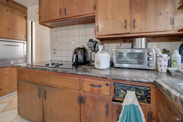 a utility room with a sink dryer and window